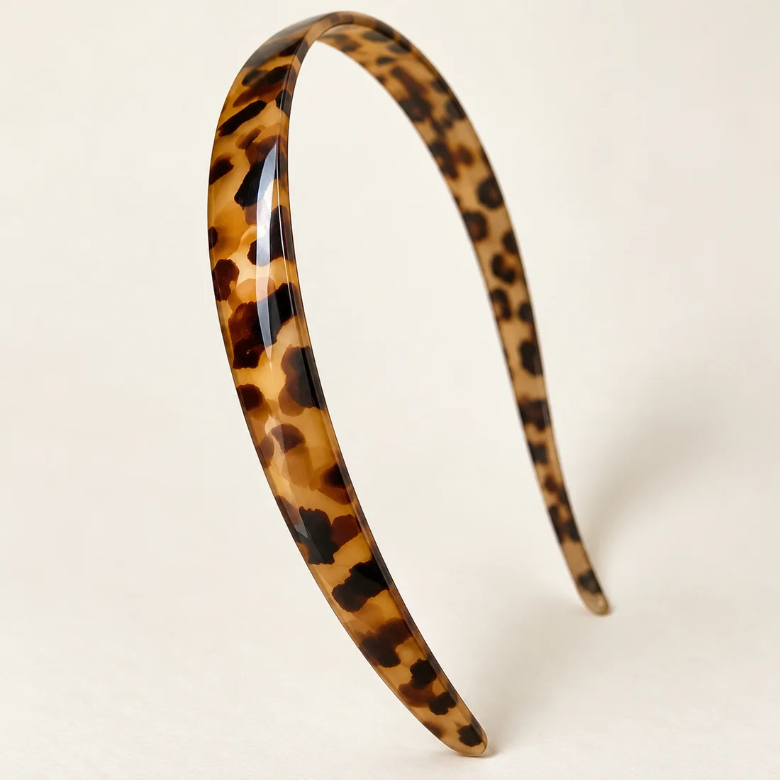 Serre-tête léopard brun brillant · détail du motif